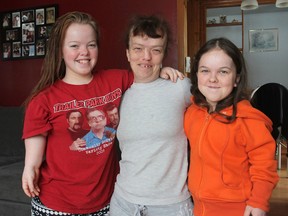 Melissa Asselstine, left, her mother Sherri Murray and her sister Myranda Murray all have a form of dwarfism. They regularly endure the stares and comments of other people and wish the curious would simply talk to them rather than see them as oddities. (Michael Lea/The Whig-Standard)