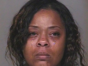 Shanesha Taylor, 35, is pictured in this undated handout booking photo from the Scottsdale Police Department obtained by Reuters April 7, 2014.  Arizona prosecutors will proceed to trial to press felony child abuse charges against a woman who drew national attention when she left her two young sons in a hot car while attending a job interview, a county attorney's spokesman said on November 7, 2014.  REUTERS/Scottsdale Police Department/Handout via Reuters