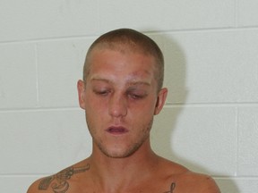 Police photo of Jessy Herlichka after his arrest shows his tattoo "death is promised."