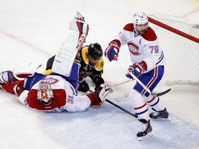 Boston Bruins forward Brad Marchand slides under Montreal Canadiens goalie Carey Price and is called for interference during the first period in Game 7 of the second round of the 2014 NHL playoffs at TD Banknorth Garden on May 14, 2014. (Greg M. Cooper/USA TODAY Sports)