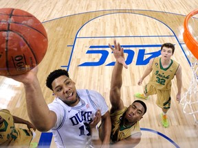 Duke’s Jahlil Okafor drives to the basket against Notre Dame. Duke, a No. 1 seed, starts its first-round play on Friday. (AFP)