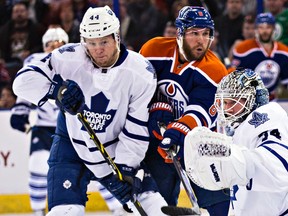 Edmonton’s Derek Roy keeps his eyes on the puck as Toronto’s goalie James Reimer  makes a save during the first period of the Edmonton Oilers’ NHL hockey game against the Toronto Maple Leafs at Rexall Place Monday night. (Codie McLachlan, Edmonton Sun)