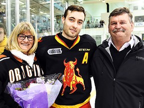 Belleville defenceman Adam Bignell is a second generation Bull. He's shown with his billets, Irene and Rob Cooke, during the team's billet appreciation ceremony last weekend. The Cooke family are the longest-serving Bulls billets, providing a home-away-from-home for Belleville players since 1987. (Aaron Bell/OHL Images)
