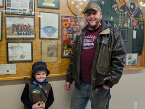 rank Pope and his 5-year-old son Cain Pope pose at Scout Hall during 1st Cochrane Ontario Scout group's open house and celebration of the 40th anniversary of Beavers. The Popes have three generations of Scouts Frank's father Fred Pope was a Scout and a leader, Frank was a Scout when he was younger, and now Frank's son Cain is in Beavers.