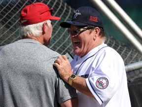 Former Major League Baseball player Pete Rose talks with manager Butch Hobson of the Lancaster Barnstormers during batting practice prior to managing the game for the Bridgeport Bluefish at The Ballpark at Harbor Yard on June 16, 2014. (Christopher Pasatieri/Getty Images/AFP)
