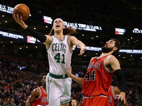 Kelly Olynyk of the Boston Celtics takes a shot over Nikola Mirotic of the Chicago Bulls during the third quarter at TD Garden on January 16, 2015. (Maddie Meyer/Getty Images/AFP)