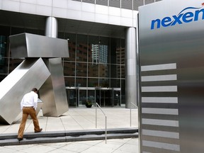 A man walks into the Nexen building in downtown Calgary.

REUTERS/Todd Korol