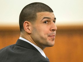 Former Patriots football player Aaron Hernandez listens to testimony during his murder trial in Fall River, Mass., on Tuesday, March 17, 2015. Hernandez is charged with killing semi-professional football player Odin Lloyd. (Aram Boghosian/Reuters/Pool)