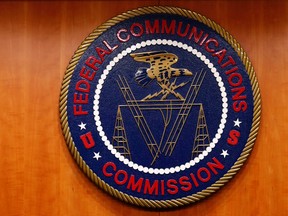 The Federal Communications Commission logo is seen before the FCC Net Neutrality hearing in Washington Feb. 26, 2015. REUTERS/YURI GRIPAS