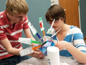 Ecole secondaire St. Francois Xavier students Nathaniel Tessier and Sophia Kooy participate in an Impromptu Design Challenge at Lambton College in this 2012 file photo. The challenge was to build a windmill that could generate electricity with magnets. (SUBMITTED PHOTO/FOR THE OBSERVER/QMI AGENCY)