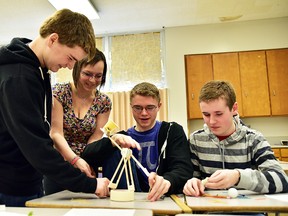 Submitted photo: A Wallaceburg District Secondary School engineering team works together at the high school engineering competition held in Chatham on March 7 sponsored by the Chatham-Kent branch of the Professional Engineers of Ontario. They include, from left to right, Alex Gough, Hannah Charron, Justin Everaert and Matthew Forgie. The quartet finished in first-place out of 15 teams, as WDSS swept the podium, winning the top three spots in the competition.