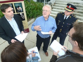 Dr. Ken Clarke, centre, is joined by United Way Perth-Huron executive director Ryan Erb, at left, and 2014 campaign co-chair John Bates at the release of the Social Research and Planning Council quality of life report last October. (SCOTT WISHART/The Beacon Herald files)