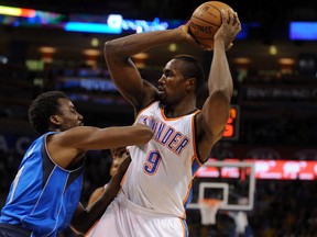 Oklahoma City Thunder forward Serge Ibaka (9) handles the ball against Dallas Mavericks forward Al-Farouq Aminu during NBA play at Chesapeake Energy Arena.  (Mark D. Smith/USA TODAY Sports)