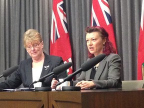 Labour and Immigration minister Erna Braun, left, and health minister Sharon Blady address media at a press conference Tuesday, March 17, 2014.