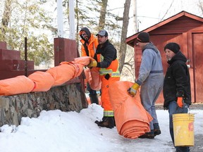 Contractors insulate a bibbing system for homes on Ash Street in this file photo, taken a couple of winters ago during a particularly nasty cold spell. (John Lappa/Sudbury Star)
