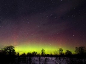 The glow of the Aurora Borealis, or Northern Lights, is seen in the horizon in the Kawartha Lakes region, southern Ontario in this Feb. 23, 2015 file photo. (FRED THORNHILL/Reuters)
