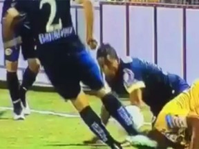 Club America's Michael Arroyo appears to purposely kick Herediano’s Cristian Lagos in the head during CONCACAF Champions League action on March 17, 2015. (YouTube screen grab)