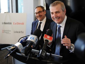 Martin Cauchon, left, and CEO Claude Gagnon announce a new press group, Capital Media Group, after acquiring six regional dailies from Gesca in Quebec City, March 18, 2015. Martin Cauchon and CEO Claude Gagnon. (STEVENS LEBLANC/QMI Agency)