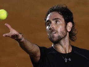 Wayne Odesnik of the U.S. serves to David Ferrer of Spain during their men's singles match at the Mexican Open tennis tournament in Acapulco February 27, 2013. (REUTERS/Henry Romero)