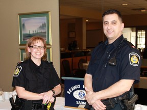 Sarnia Police Services' Sgt. Daun-Mari Price and Sgt. John Sottosanti stand following the Seaway Kiwanis Club's Mar. 10 meeting at the Sarnia Golf & Country Club. Sgt. Price gave a presentation to Kiwanis members about the Forensic Identification Branch and its work in Sarnia. 
CARL HNATYSHYN/SARNIA THIS WEEK/QMI AGENCY