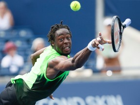 This photo of Gael Monfils diving desperately for the ball in action against Novak  Djokovic at the Rogers Cup in Toronto August 6, 2014 has netted Sun photographer Stan Behal a National Newspaper Award nomination.