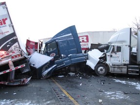 A 50-vehicle crash closed the westbound lanes of Highway 401 near Trenton, Ont., early Wednesday morning. Emergency crews remain on the scene cleaning up the mess and removing dozens of vehicles from the scene. (Jason Miller/QMI Agency)