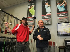 Justin MacDonald, left, and Ken Thompson of ACCRA Golf, which is among the worldwide leaders in manufacturing high-performance shafts, pose with a few of the company's premier shafts in the head office in Kingston on Wednesday. (Julia McKay/The Whig-Standard)