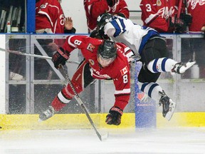 Leamington Flyers defenceman Ryan Shipley slams London Nationals forward Rai Di Loreto during Game 4 of their GOJHL playoff series at the Western Fair Sports Centre on Wednesday. (CRAIG GLOVER, The London Free Press)