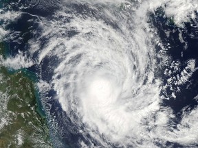 NASA's Aqua satellite captured this image of  Tropical Cyclone Nathan at 1:35 p.m. local time (03:35 Universal Time) on March 17, 2015 as it bore down on northeastern Queensland, Australia.    AFP PHOTO / NASA