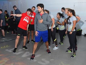 Actor Adrian Grenier trials a pair of Reebok ZPump Fusion shoes at Reebok's launch of the revolutionary new ZPump Fusion at Spring Studios on March 4, 2015 in New York City.  Michael Loccisano/AFP
