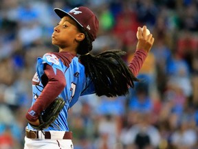 Mo'ne Davis of Pennsylvania pitches to a Nevada batter during the first inning of the United States division game at the Little League World Series tournament at Lamade Stadium on August 20, 2014. (Rob Carr/Getty Images/AFP)