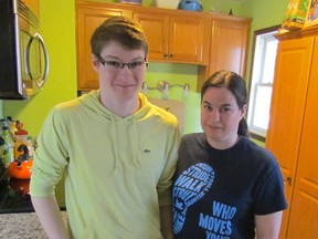 Dillon Young, 17, and his mother, Sherri Andrews, stand in the family's kitchen on Wednesday March 18, 2015 in Sarnia, Ont. Young was diagnosed with arthritis at age eight and he and his family will be part of a team participating in London's Walk to Fight Arthritis later this year. (Paul Morden, The Observer)