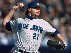 Former Blue Jays pitcher Roger Clemens reached a settlement to a defamation lawsuit with his former trainer on Wednesday. (Peter Jones/Reuters/Files)