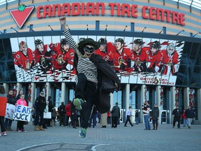 Jonney Petsche was excited to take in the Senators game against the Boston Bruins at the Canadian Tire Centre on Thursday, March 19, 2015. Petsche was dressed up as the Hamburglar in support of Senator's goalie Andrew Hammond.  
Tony Caldwell/Ottawa Sun/QMI Agency