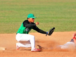 Yoan Moncada (left) from the Cienfuegos team plays second base during the Cuban National Series All-Star game in Sancti Spiritus on March 24, 2013. (Reuters/Files)