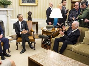 U.S. President Barack Obama (C), Prince Charles, Prince of Wales, (2nd L) and his wife Camilla, the Duchess of Cornwall, watch as U.S. Vice President Joe Biden leans away from microphone booms in the Oval Office of the White House in Washington March 19, 2015.      REUTERS/Joshua Roberts