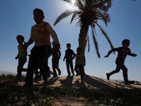 Syrian refugee children (Muhammad Hamed/Reuters)