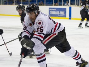 Ryan Trottier (No. 25 in white) had a strong game for the Sarnia Legionnaires Thursday, scoring twice. But it wasn't enough to prevent the Sarnians from losing the contest in overtime. (Submitted photo by Anne Tigwell)