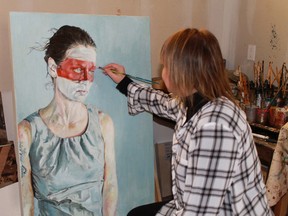 Alvinston artist Liana Russwurm puts the finishing touches on an untitled painting.
CARL HNATYSHYN/ QMI AGENCY