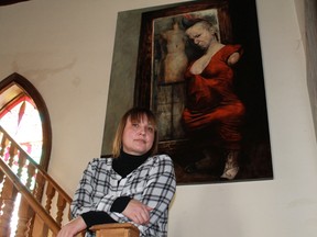 Liana Russwurm stands in front of her portrait, 'The Judy' in her Alvinston home. 
(CARL HNATYSHYN, QMI Agency)