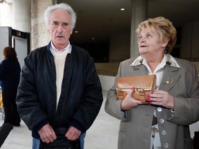 Pierre Le Guennec (L) and his wife Danielle (R) arrive for the verdict of their trial at the courthouse in Grasse, southeastern France, March 20, 2015. Pierre Le Guennec, a retired electrician and former Picasso employee, and his wife, charged with possession of 271 stolen drawings and paintings by late Spanish artist Pablo Picasso,  were sentenced to a two year suspended sentence and ordered return the artwork to the family.  REUTERS/Eric Gaillard