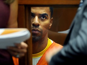 Former NFL player Darren Sharper sits in a Los Angeles courtroom on March 24, 2014, during  bail hearing.  Sharper is awaiting trial in Los Angeles after pleading not guilty to charges that he raped and drugged two women last year. (AFP PHOTO/POOL/Wally SKALIJ)
