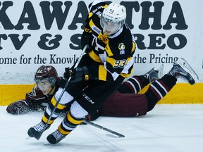 Kingston Frontenacs’ Sam Bennett skates away from the Petes' Jonathan Ang during Ontario Hockey League action in Peterborough on March 10. (Clifford Skarstedt/QMI Agency)