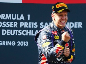 Formula One driver Sebastian Vettel celebrates after winning the German Grand Prix at the Nuerburgring circuit, July 7, 2013. (REUTERS/Kai Pfaffenbach)