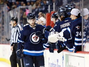 Drew Stafford celebrates his shootout goal Thursday night. He also scored the game-tying goal and has six goals and 11 points in 15 games with the Jets.
