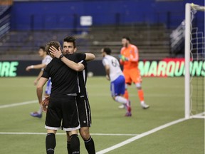 Ottawa Fury FC striker Andrew Wiedeman celebrates his first-half goal with teammate Oliver during Friday's friendly between Fury and FC Montreal at Olympic Stadium. (Chris Hofley/Ottawa Sun)