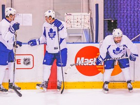 The beleaguered top line of (from left) James van Riemsdyk, Tyler Bozak and Phil Kessel awaits its turn during yesterday’s drills at the MasterCard Centre. (DAVE THOMAS, Toronto Sun)
