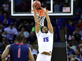 Duke Blue Devils’ Jahlil Okafor misses a reverse dunk against the Robert Morris Colonials on Friday night in Charlotte. Duke had a record-setting 28 assists in the win. (USA TODAY SPORTS/PHOTO)