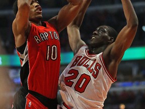 Raptors’ DeMar DeRozan is fouled by the Bulls’ Tony Snell in Chicago last night. DeRozan had 27 points in the loss. (AFP)
