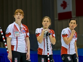 Canada's Dawn McEwen (from left), Kaitlyn Lawes and Jill Officer watch Switzerland play during the Page Playoff 1-2 game at the World Women's Curling Championships in Sapporo, Japan, March 21, 2015. (REUTERS/Thomas Peter)